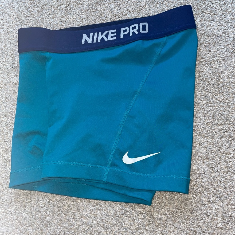 teal nike pros